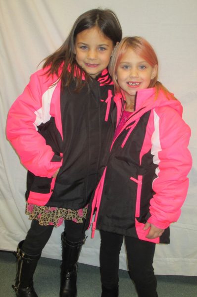 1 - 2 girls in pink coats