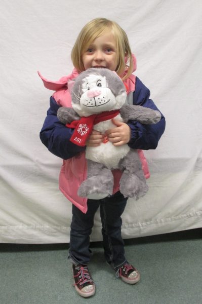 11 - Little girl with her new coat and stuffed animal
