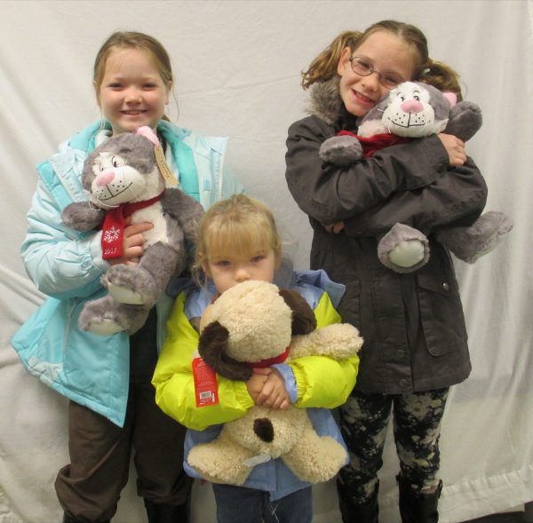 13 - 3 sisters with their new coats and stuffed animals