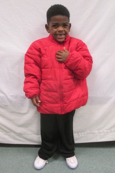 14 - Proud little boy with his new red coat