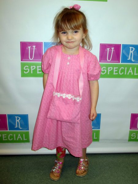 24 - Little girl wearing her new pink dress