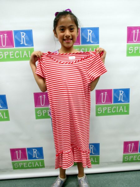 27 - Girl poses proudly with red and white striped dress