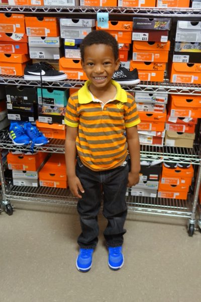 3 - Little boy loving his new blue shoes