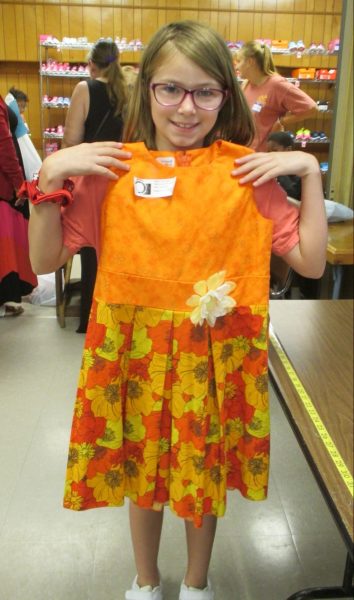 7 - Proud girl with her new orange flower dress