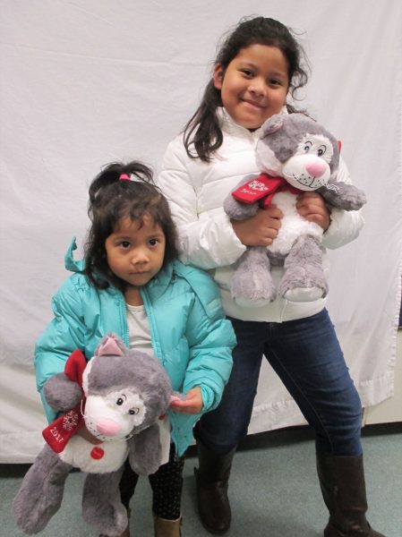 9 - Sisters with their new coats and stuffed animals