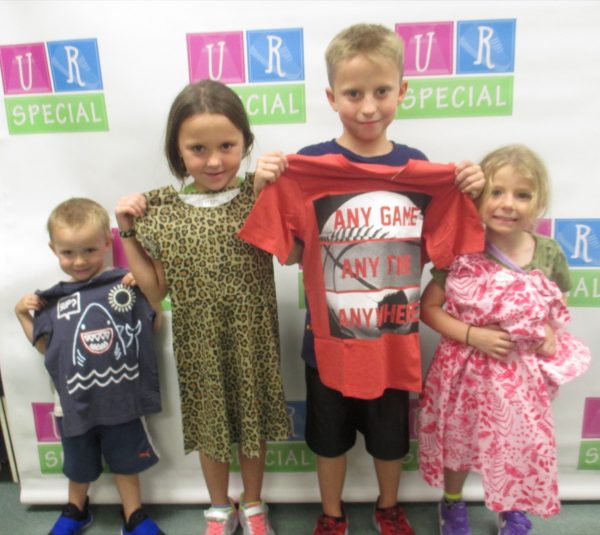 Four siblings show off their new clothes